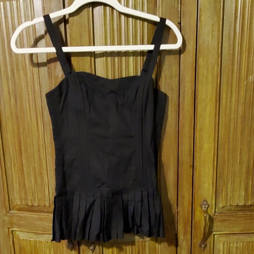 Peplum style tank top tight fit and pleated flare